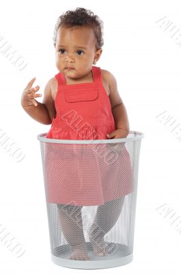 Beautiful African baby inside a trash