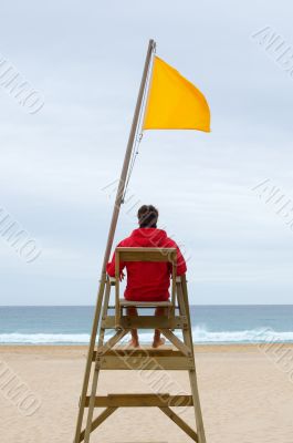 Lifeguard sitting in his chair