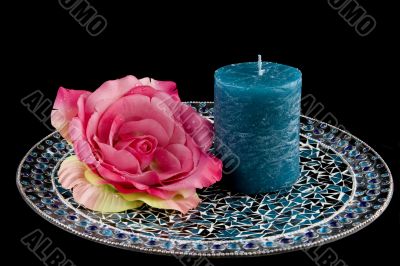 Blue candle with pink rose
