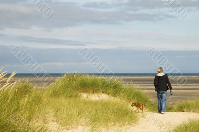 Walking the dog near the beach