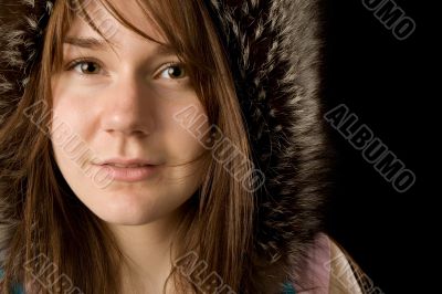 serious young woman in fur hat