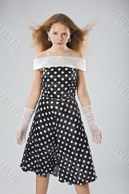 serious woman in black and white dress