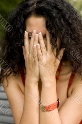 woman hiding her face