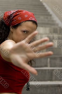 woman in red hides her face