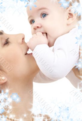 happy mother playing with baby boy