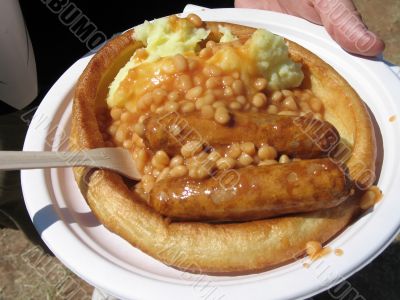 bangers and mash on a paper plate