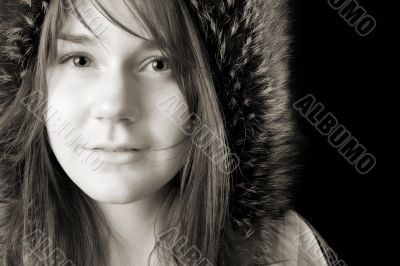 serious young woman in fur hat