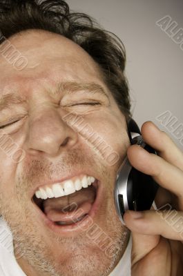 Ecstatically Happy Man on Cell Phone