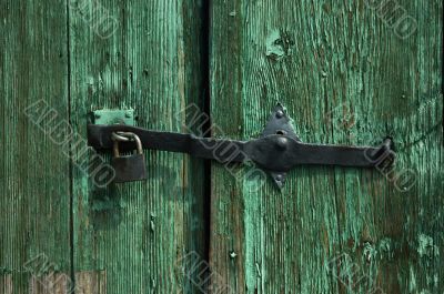 Lock on a wooden green door