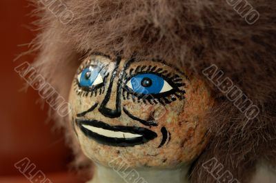 Head of Finnish souvenir doll made of stone