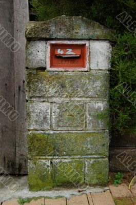 Old mail box covered with moss