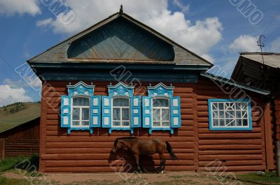 Old Village House with a horse