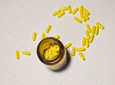 medicine bottle with isolated pills
