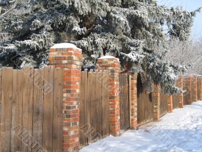 wooden fence with snow