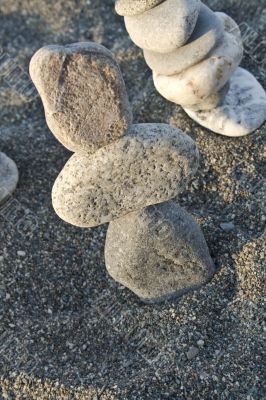three stones cairn on the beach