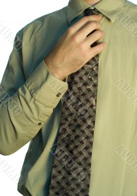 Man Adjusting His Tie