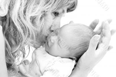 Mother kissing her child