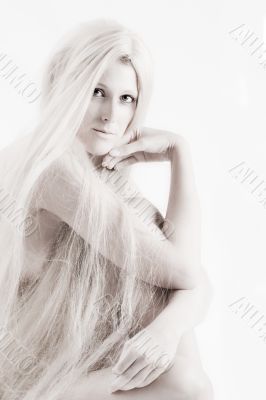 Long blond haired artistic beauty checking you out