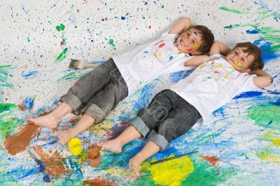 Two young boys lying