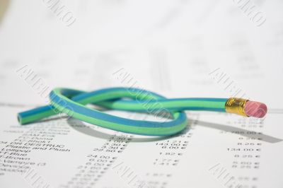 Green rubber pencil twisted into a knot