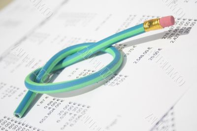 Green rubber pencil twisted into a knot
