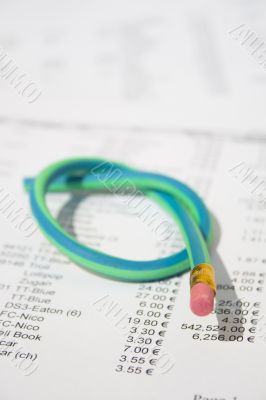 Green rubber pencil twisted into a knot
