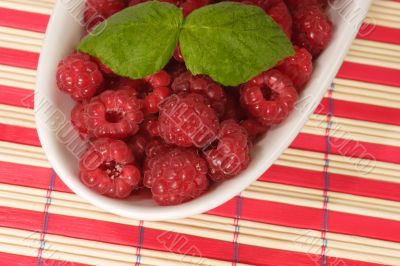 Raspberries and Leaves on a Plate