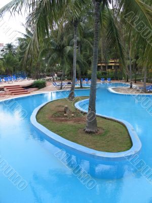 blue pool in a tropical setting