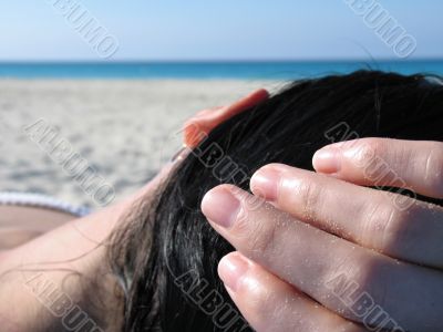 girl laying on the beach