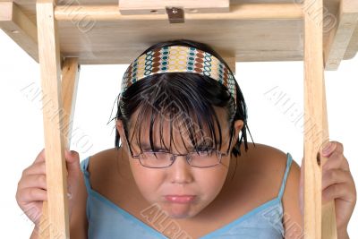 Girl Hiding Under Table