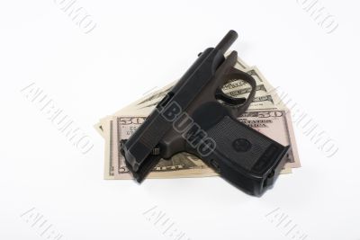 Pistol and dollars