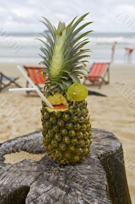 Pineapple, cocktail on the beach