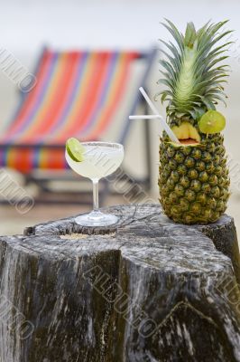 Pineapple, cocktail on the beach
