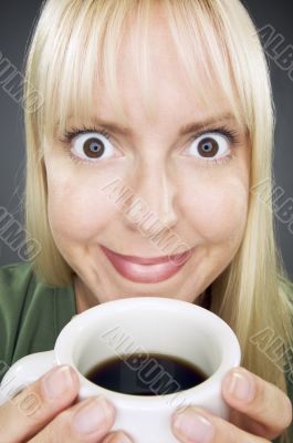 Beautiful Woman Enjoys Coffee