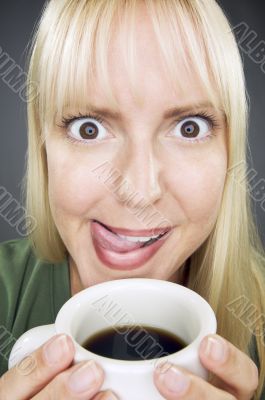 Beautiful Woman Enjoys Coffee