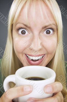 Beautiful Woman Enjoys Coffee
