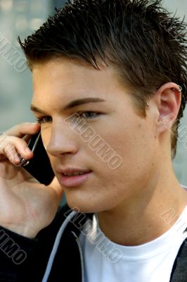 Portrait of a young man with mobile phone