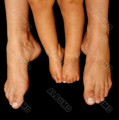 Mother`s and baby`s feet