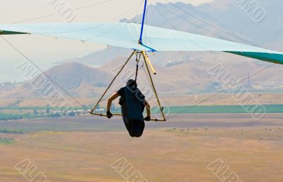 Light blue hangglider just launched