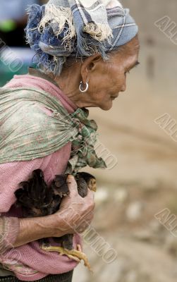 Asia, old woman with chicken