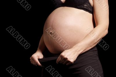 woman show pregnant belly