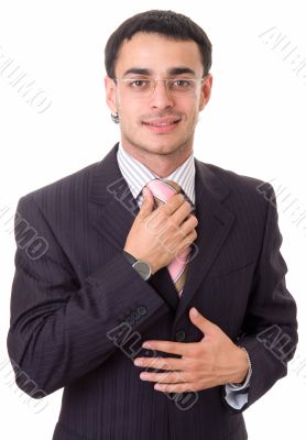 adjusting his tie