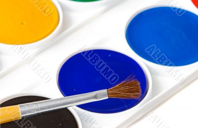 Box of watercolors with brush