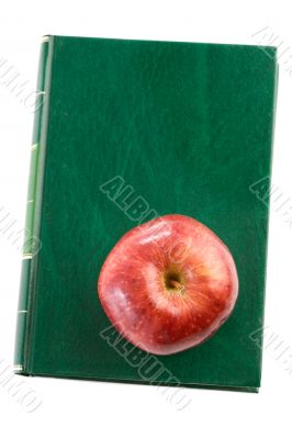 Apple red on a green book