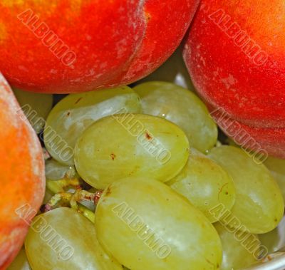 appetizing bunch of grapes and peach