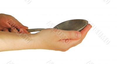 hand holds spoon