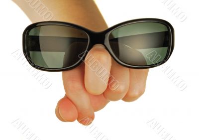 glasses on a womanish hand