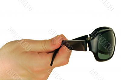 glasses on a womanish hand