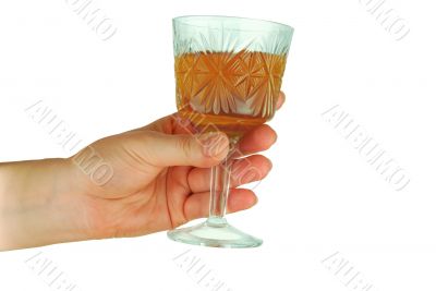  womanish hand holds crystal glass with wine