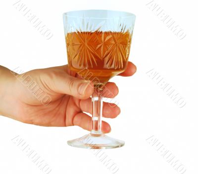  womanish hand holds crystal glass with wine